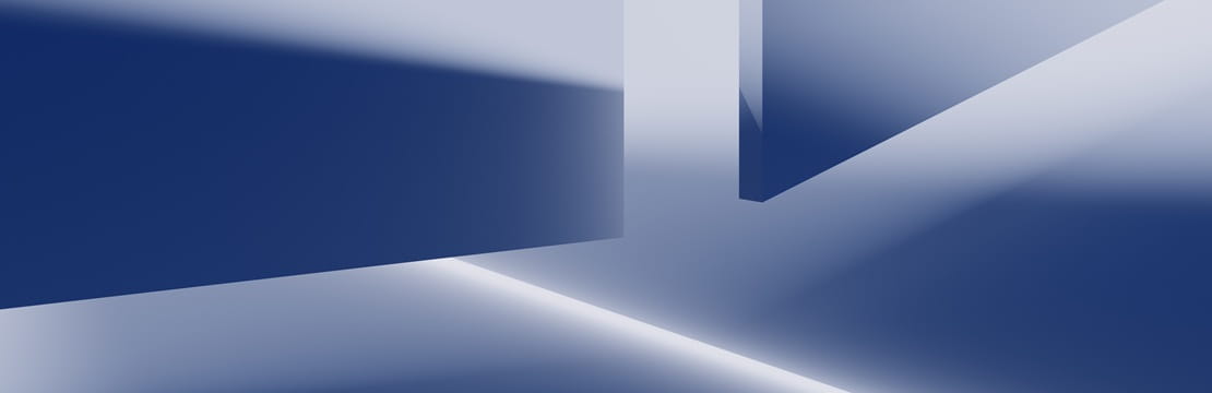 Abstract geometric shapes with sharp edges casting blue and white light and shadows.